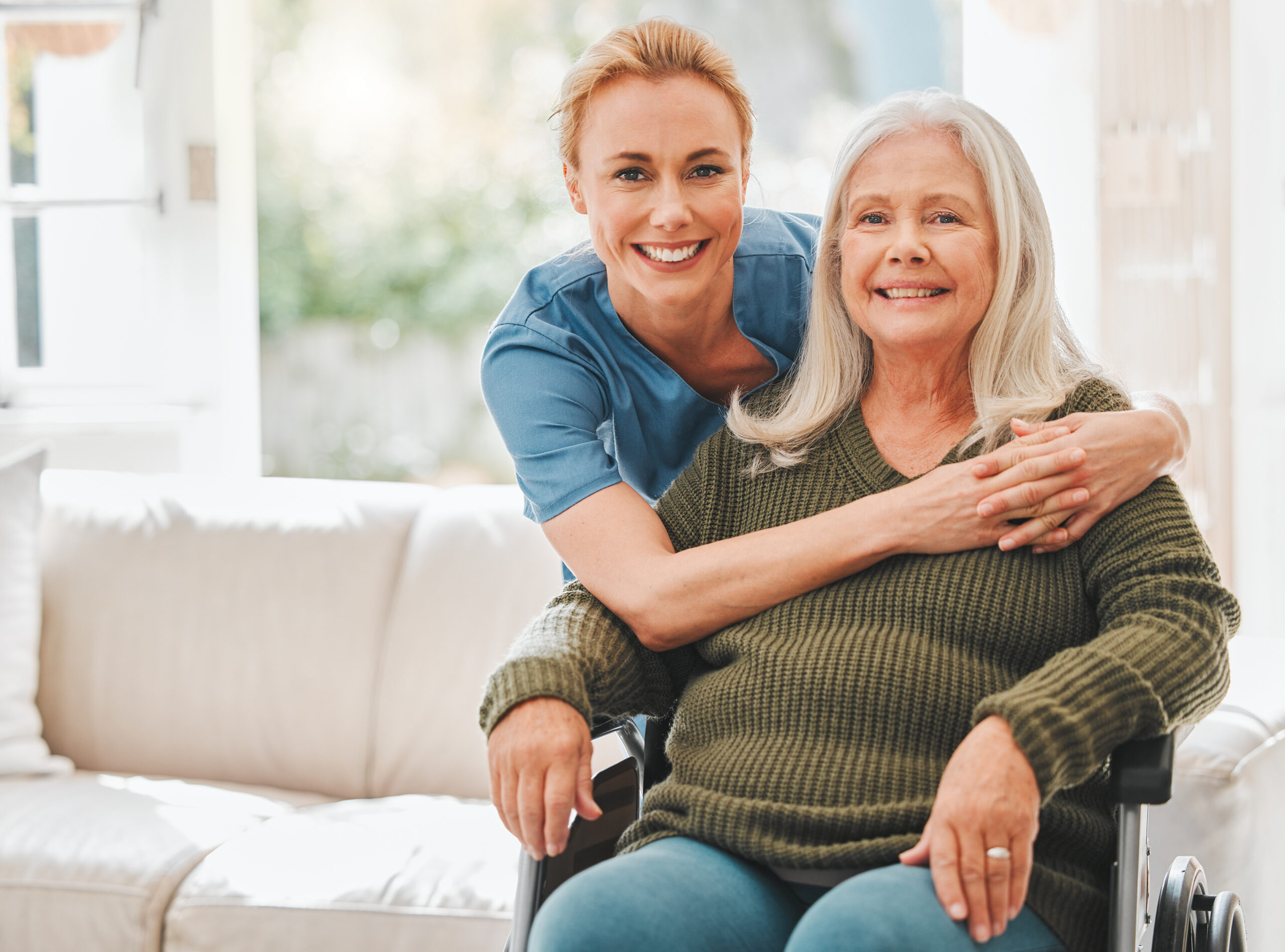 Shot of a female nurse hugging her mature patient.